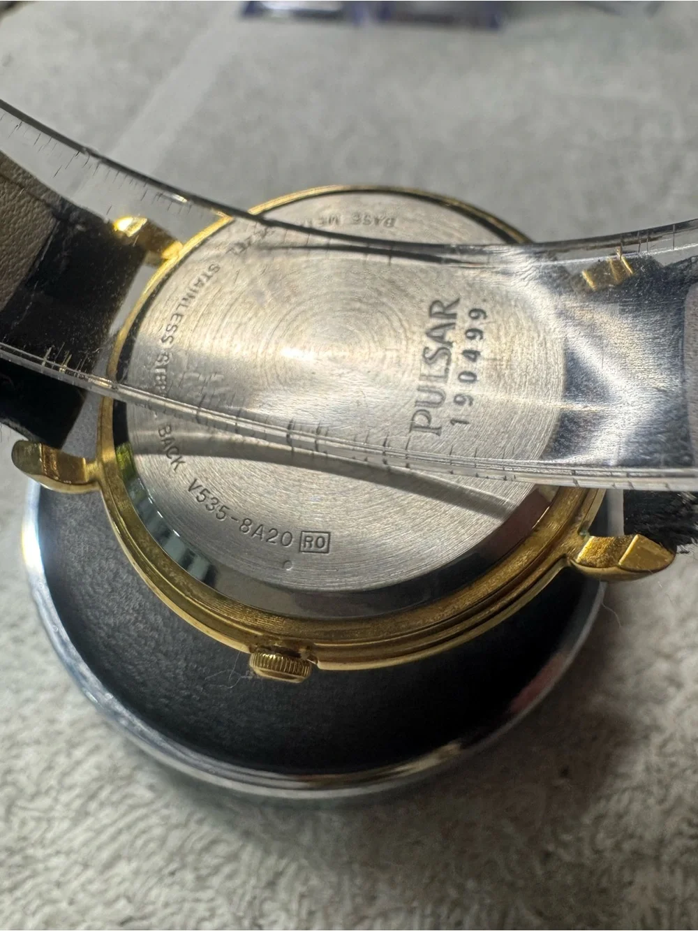Pulsar Gold Tone Watch with White Dial and Black Strap